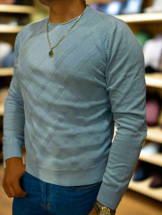 Light blue sweater worn by a person with a blurred background